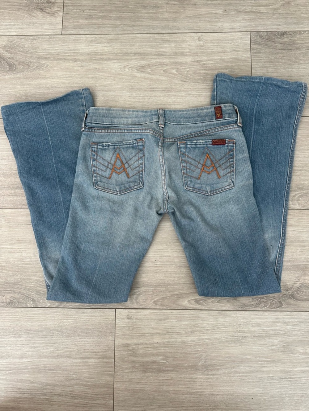 Seven for all mankind A pocket light wash low rise bootcut jeans 26